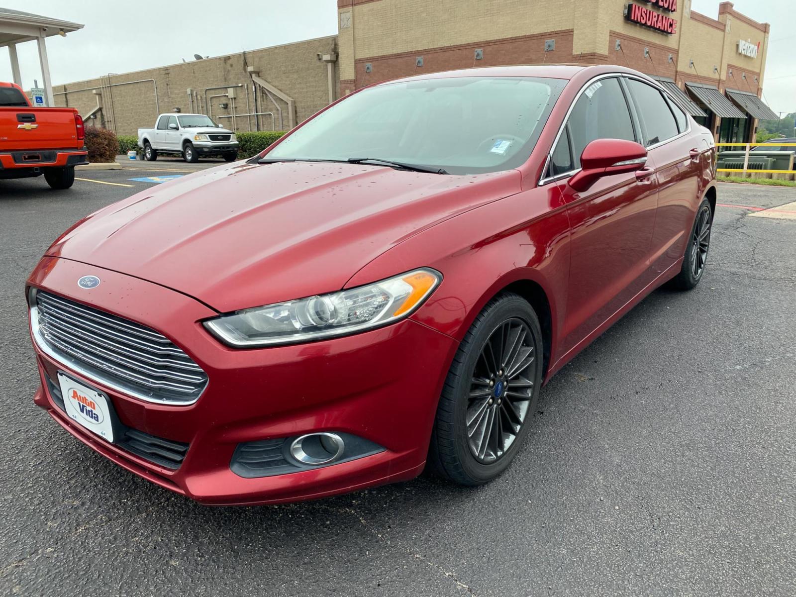 2013 RED Ford Fusion SE (3FA6P0HRXDR) with an 1.6L L4 DOHC 16V engine, located at 420 I-35E, Lancaster, TX, 75146, (469) 297-4144, 32.593929, -96.823685 - Photo #1