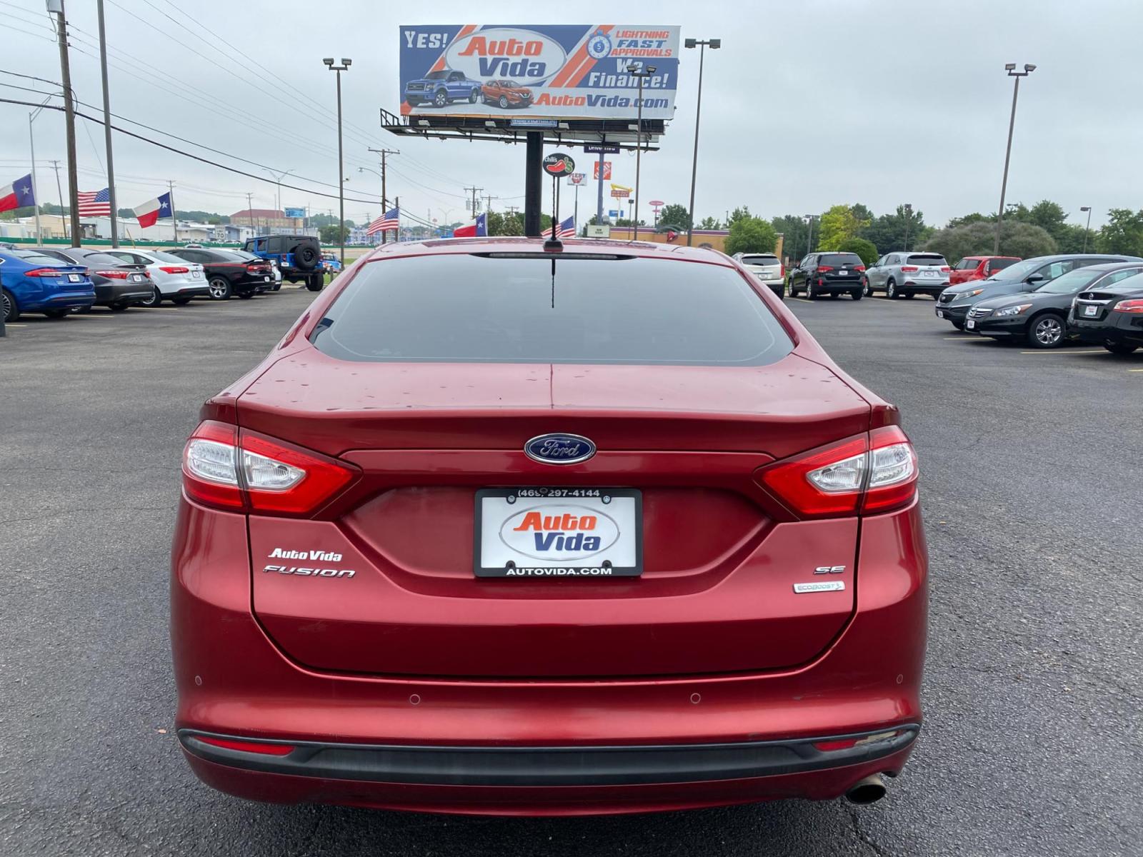 2013 RED Ford Fusion SE (3FA6P0HRXDR) with an 1.6L L4 DOHC 16V engine, located at 420 I-35E, Lancaster, TX, 75146, (469) 297-4144, 32.593929, -96.823685 - Photo #3