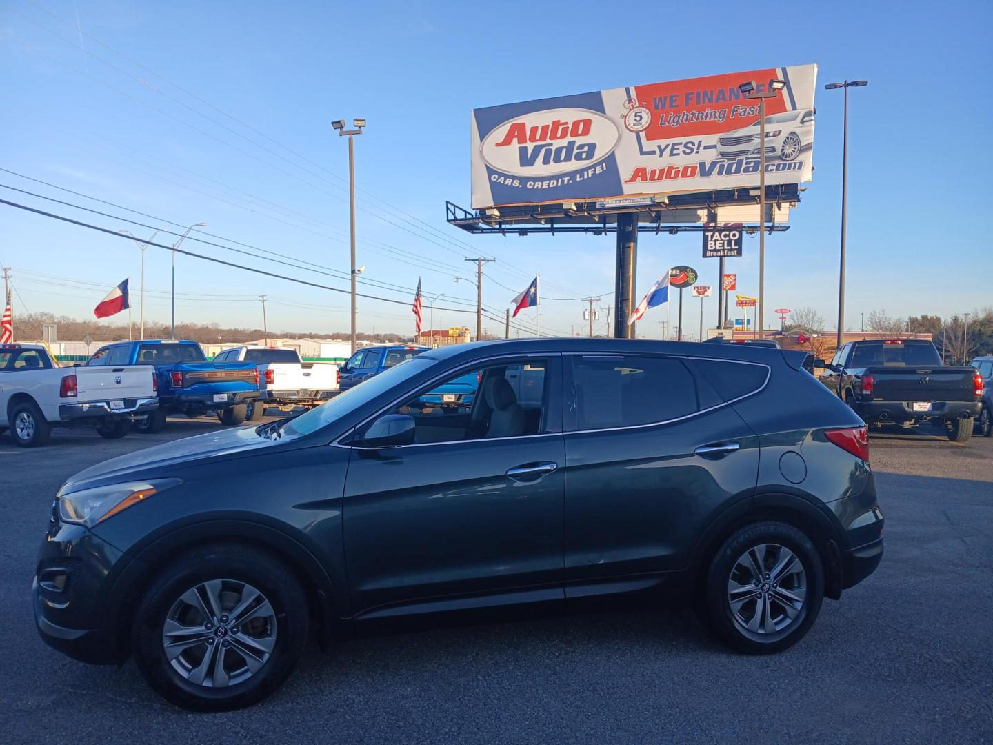 2014 GREEN Hyundai Santa Fe Sport 2.4 FWD (5XYZT3LB1EG) with an 2.4L L4 DOHC 16V engine, 6-Speed Automatic transmission, located at 420 I-35E, Lancaster, TX, 75146, (469) 297-4144, 32.593929, -96.823685 - Photo#1