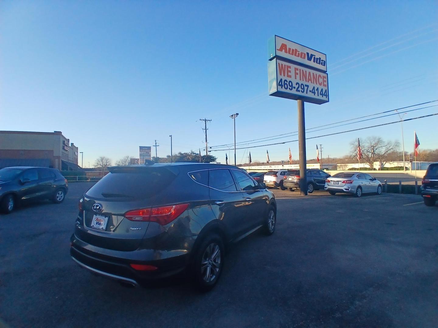 2014 GREEN Hyundai Santa Fe Sport 2.4 FWD (5XYZT3LB1EG) with an 2.4L L4 DOHC 16V engine, 6-Speed Automatic transmission, located at 420 I-35E, Lancaster, TX, 75146, (469) 297-4144, 32.593929, -96.823685 - Photo#2