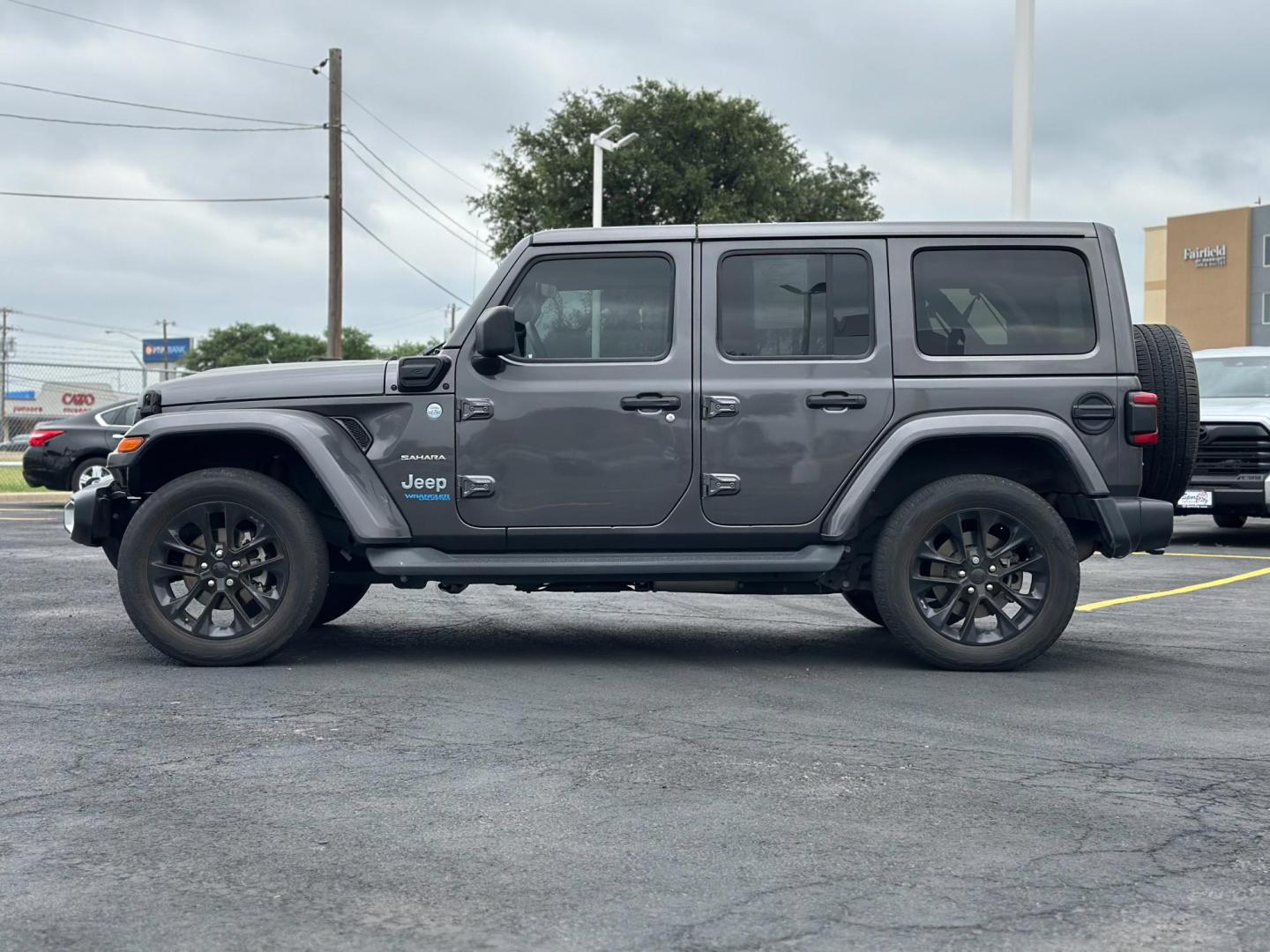 2021 GRAY Jeep Wrangler Unlimited Sahara 4XE (1C4JJXP60MW) with an 2.0L L4 DOHC 16V HYBRID engine, 8A transmission, located at 8640 E R L Thornton Fwy, Dallas, TX, 75228, (469) 297-4144, 32.794128, -96.693008 - Photo#6