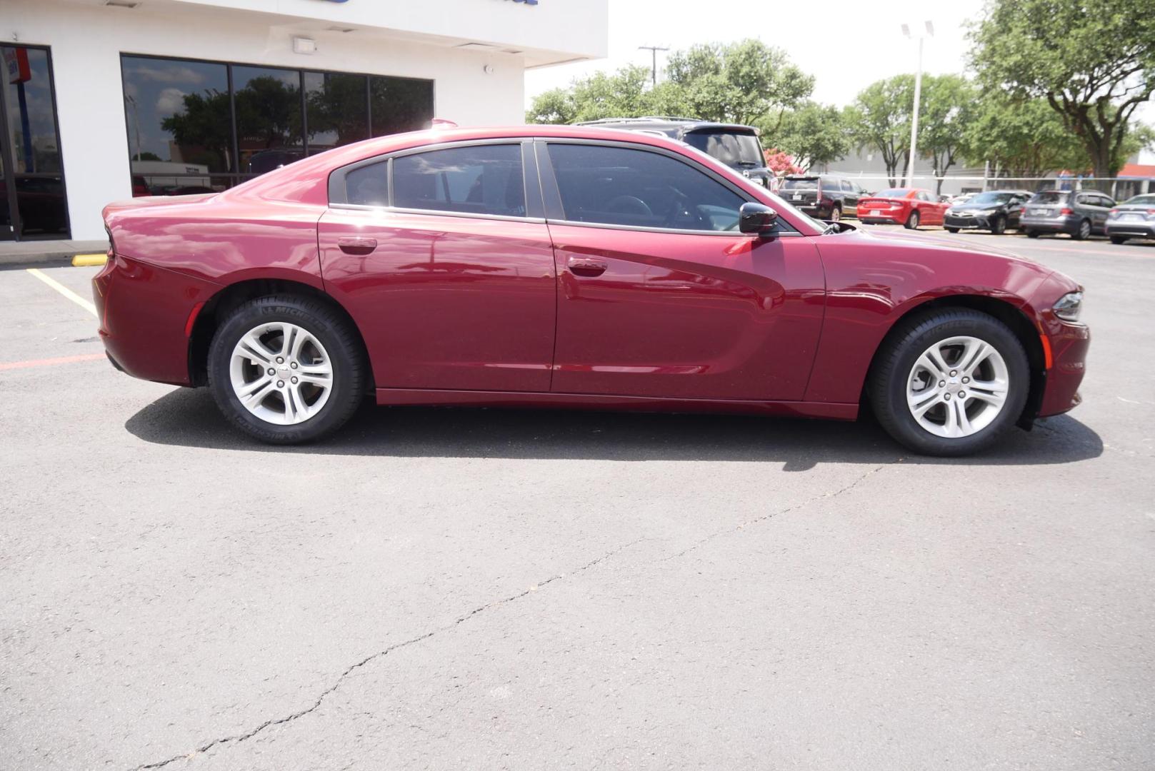 2023 RED Dodge Charger SXT (2C3CDXBG7PH) with an 3.6L V6 DOHC 24V engine, 8A transmission, located at 8640 E R L Thornton Fwy, Dallas, TX, 75228, (469) 297-4144, 32.794128, -96.693008 - Photo#1