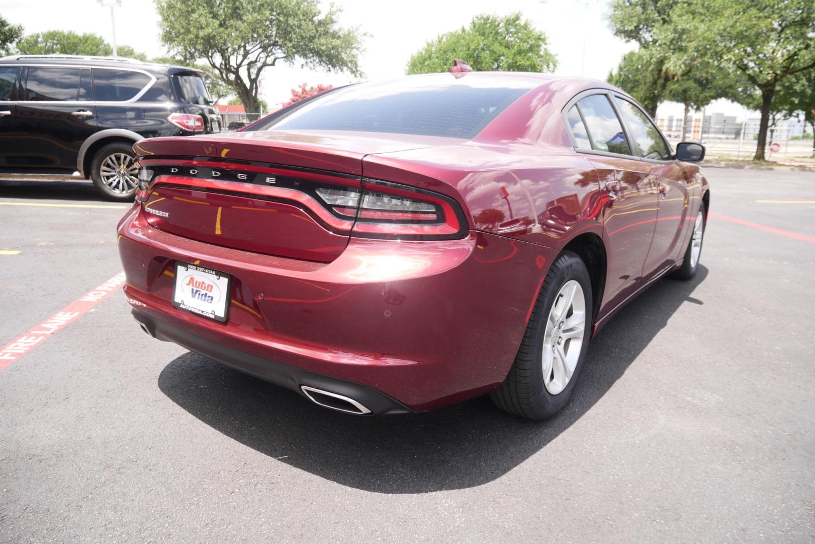 2023 RED Dodge Charger SXT (2C3CDXBG7PH) with an 3.6L V6 DOHC 24V engine, 8A transmission, located at 8640 E R L Thornton Fwy, Dallas, TX, 75228, (469) 297-4144, 32.794128, -96.693008 - Photo#2
