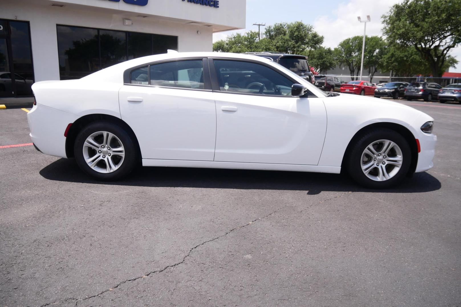 2023 WHITE Dodge Charger SXT (2C3CDXBG0PH) with an 3.6L V6 DOHC 24V engine, 8A transmission, located at 8640 E R L Thornton Fwy, Dallas, TX, 75228, (469) 297-4144, 32.794128, -96.693008 - Photo#1
